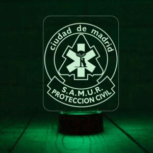 Lámpara LED del SAMUR Protección Civil grabada en metacrilato con iluminación RGB, mando a distancia y base LED multicolor.